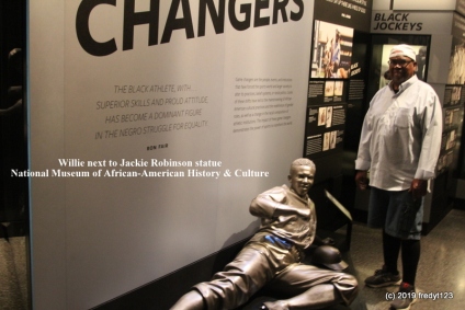 Willie posing by Jackie Robinson exhibit